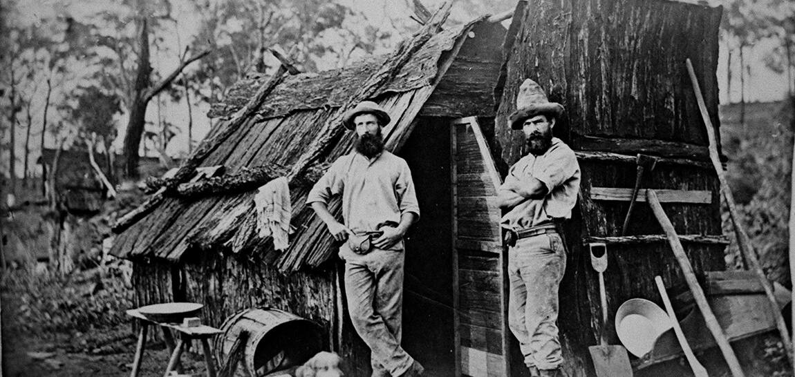 Gold-miners-outside-a-bark-hut-State-Library-Queensland-71854.jpg